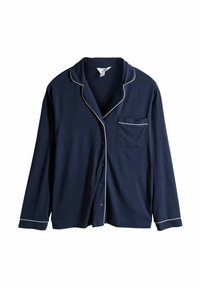 Mörkblå knäppbar pyjamasöverdel i mjukt tyg, med vit kantning längs kragen, fickan och knäppningen. Långa ärmar.