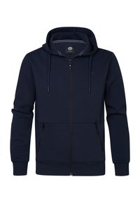 Navy zip-up hoodie with a drawstring hood, side zip pockets, ribbed cuffs, and a soft texture. Features a logo on the chest.