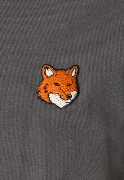 Gray fabric t-shirt featuring an embroidered orange fox head with white accents, centrally positioned on the chest.