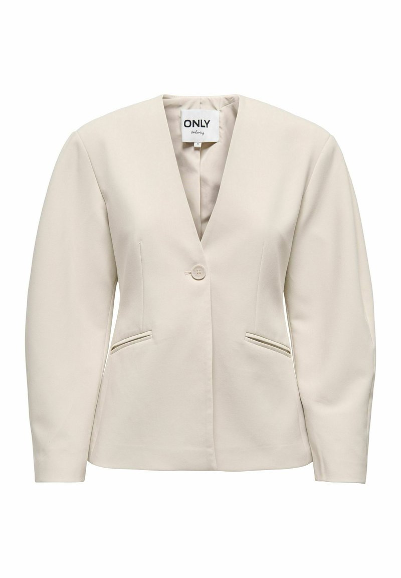 Bēša žakete ar V veida izgriezumu, vienu pogu un divām priekšējām kabatām. Izgatavota no gludas auduma ar strukturētu piegriezumu un garām piedurknēm.