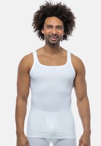White cotton tank top with wide straps, square neckline, and a fitted design. The material appears smooth with a slight sheen.