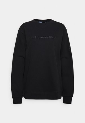 Schwarzer Sweatshirt mit Rundhalsausschnitt und langen Ärmeln, mit "KARL LAGERFELD" in Prägung über der Brust und einem kleinen Logo am linken Ärmel.