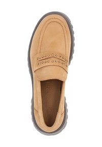 Beige suede slip-on shoe with a rounded toe, rubber sole, and decorative studs on the strap. Smooth texture and minimalistic design.