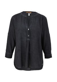Blusa da donna a maniche lunghe di un grigio scuro, con colletto rotondo, due bottoni a pressione frontali e orlo leggermente curvato.