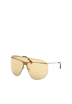 Gultonade, överdimensionerade sköldsunglasögon med tunn guldram, justerbara näskuddar och sköldpaddsliknande glasögonremmar.