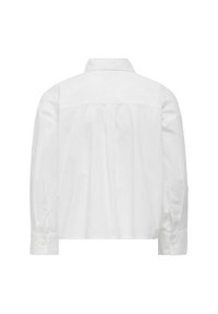 Balta trumpa palaidinė su taškiniu apykakle, ilgomis rankovėmis ir sagų užsegimais. Lygus audinys, nugaros siūlės detalė ir minimalus siuvinėjimas.