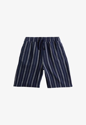 Marineblauwe korte broek met elastische tailleband en witte verticale strepen, voorzien van steekzakken aan de voorkant en een voorstrik.