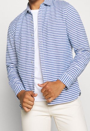 Camicia a righe blu e bianche con bottoni in un tessuto leggero, dotata di colletto classico, maniche lunghe e polsini con bottoni.