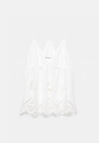 Haut blanc sans manches en dentelle avec fines bretelles, col en V et broderie florale le long de l'ourlet festonné.