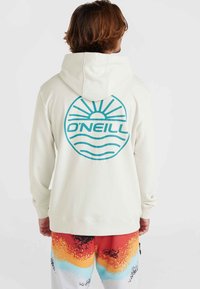 White hoodie with a turquoise circular logo featuring sun and wave graphics on the back. Cotton blend fabric, relaxed fit.