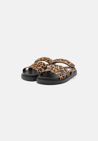 Black and leopard print sandals with two straps, open toe design, and textured rubber sole. Features adjustable straps for fit.