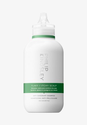 White plastic bottle with a tapered top, green label, and silver text. Contains anti-dandruff shampoo for flaky, itchy scalps. 250 ml.