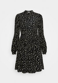 Vestido negro con mangas largas, cuello alto y cintura ajustada. Presenta un estampado floral en amarillo sobre la tela y una falda fluida.