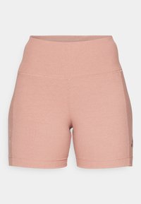 Calções com pregas, de altura média, na cor rosa suave, com uma cintura sem costura e detalhes sutis do logótipo na lateral.