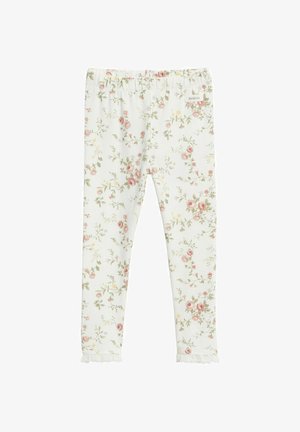 Witte babylegging met roze en groene bloemenprint, elastische tailleband en kanten rand bij de enkels.