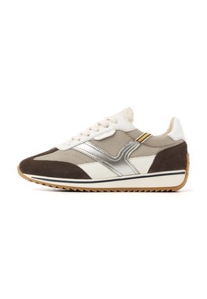 Brown and white sneaker with mesh and suede materials, silver accents, a textured sole, and a retro design featuring a rounded toe.