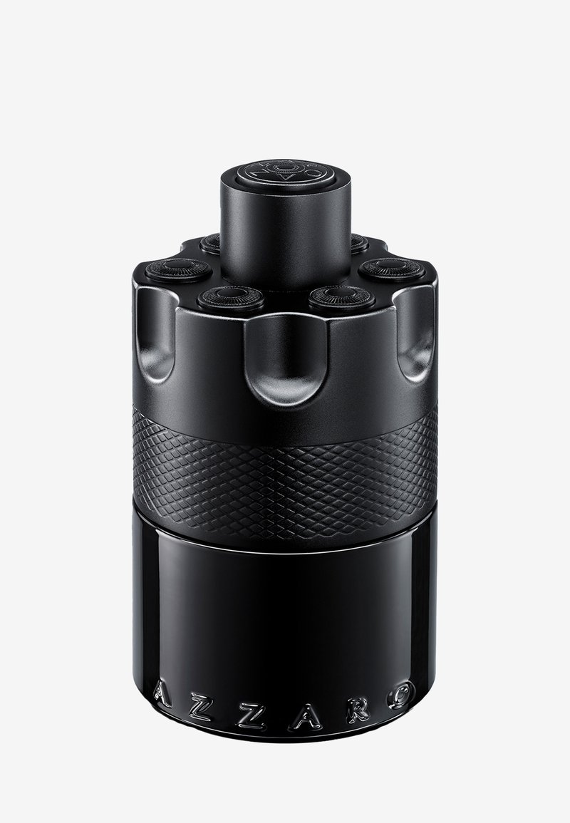 Flacon de parfum cylindrique noir avec une section centrale texturée, un bouchon supérieur circulaire et le nom de la marque "Azzaro" en relief à la base.