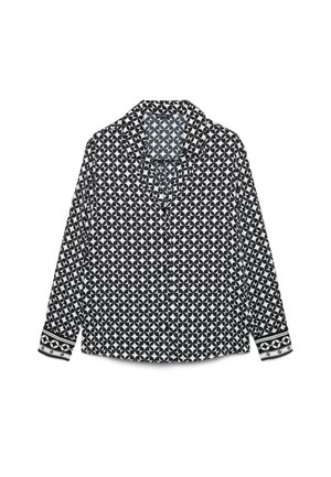 Chemise noire et blanche à manches longues avec boutons, motif géométrique de cercles et poignets décoratifs sur fond blanc.