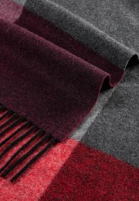 Wool scarf featuring a plaid design with burgundy, red, and gray sections, finished with black fringes. Soft texture and warm appearance.