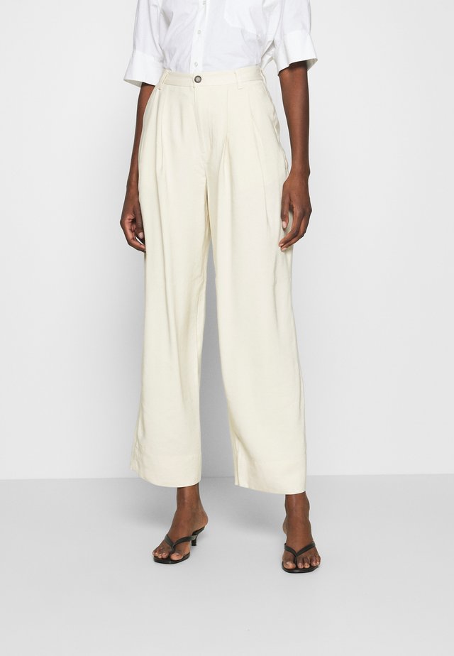 DANNIE - Trousers - oyster