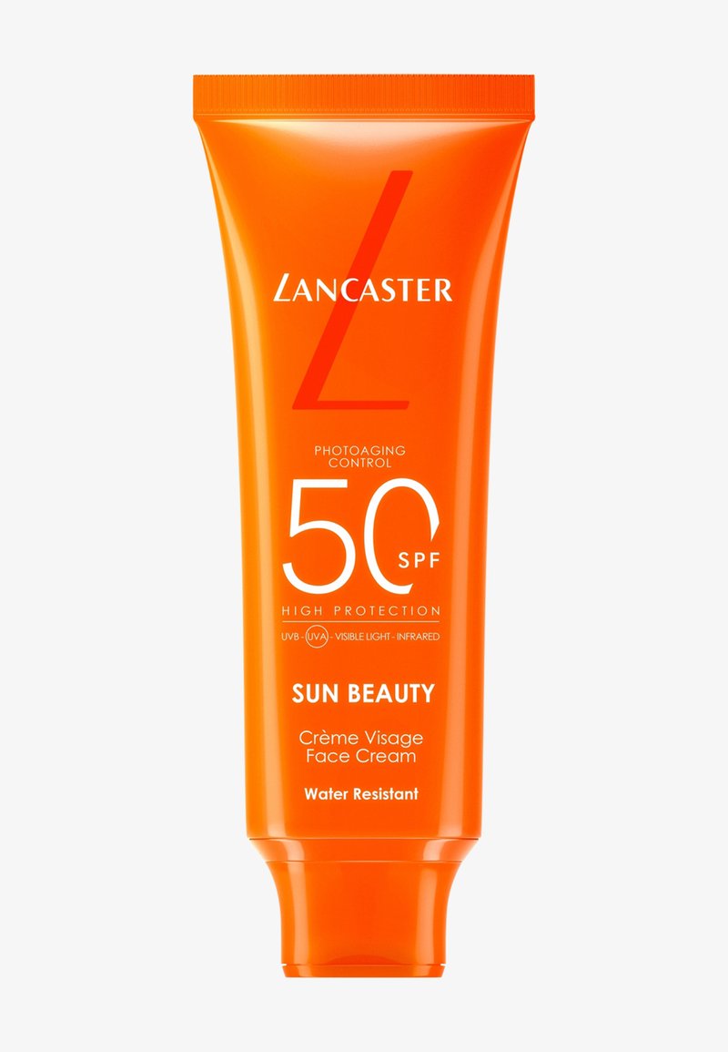 Crème visage haute protection Lancaster Sun Beauty SPF 50, tube, emballage orange, résistante à l'eau, contrôle du photo-vieillissement, protection UVB-UVA et lumière visible.