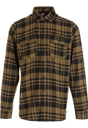 Bruine en zwarte geruite flanellen shirt met een knoopsluiting aan de voorkant, twee borstzakken en lange mouwen. Zachte textuur en een relaxte pasvorm.