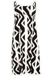 Robe noire et blanche avec un motif abstrait géométrique, à design sans manches et à coupe décontractée qui s'évase à partir de la taille.