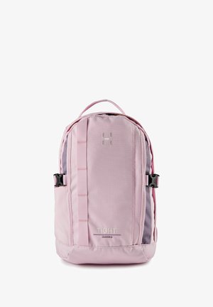 Mochila compacta de color rosa claro con hebillas laterales, asa superior, correa vertical y la marca "TIGHT Junior 8" en el panel frontal.