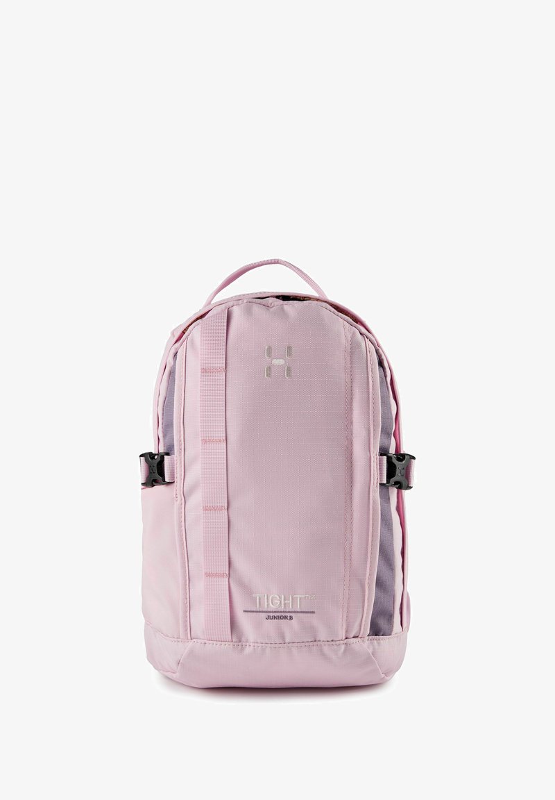 Sac à dos compact rose clair avec boucles latérales, poignée supérieure, sangle verticale, et le logo "TIGHT Junior 8" sur le panneau avant.