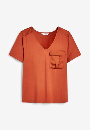 Rust orange short-sleeve t-shirt with a V-neck and a patch pocket on the left chest. Made from smooth fabric with a subtle sheen.
