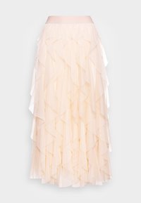 Jupe en tulle superposée de couleur beige pâle, avec des détails à volants, une ceinture lisse et une silhouette évasée.