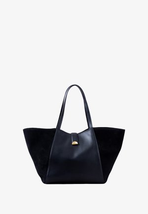 Black tote bag with contrasting suede and leather sections, angular shape, two shoulder straps, and a gold accent on the closure.