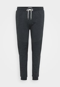 Dark grey jogger pants with white drawstring, ribbed knee detailing, elastic waistband, and cuffed ankles against a plain background.