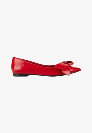 Red patent leather pointed-toe flat shoe with a large decorative bow on the front and a black sole.