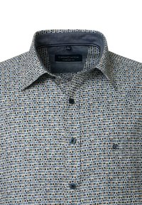 Men's long-sleeve button-up shirt with beige, blue, and black small geometric pattern and contrast inner collar.