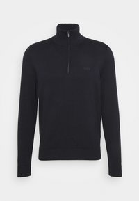 Svart zip-up tröja med hög krage, gjord av mjukt material. Har långa ärmar, ribbade muddar och subtil logotypdetalj på bröstet.