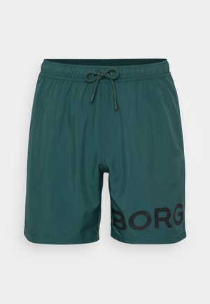 Green swim shorts with an elastic waistband and drawstring. Features black "BORG" logo on the left side. Smooth, lightweight material.