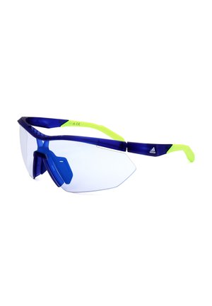 Occhiali da sole sportivi con lenti trasparenti avvolgenti, montatura anteriore blu scuro e stanghette giallo neon con logo Adidas sul lato.