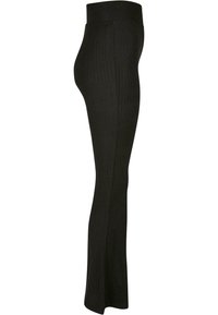 Leggings negras acanaladas con una cinturilla ancha, que cuentan con una silueta ajustada y un dobladillo ligeramente acampanado para mayor estilo y comodidad.