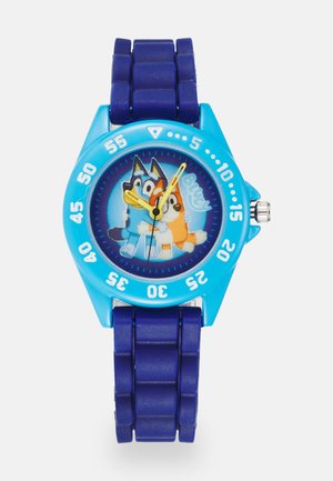 Orologio analogico per bambini con cassa in plastica blu, cinturino in silicone blu e quadrante colorato con cani dei cartoni animati. Design resistente all'acqua.