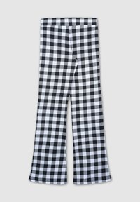 Pantaloni svasati a scacchi bianchi e neri con una consistenza liscia e tessuto elasticizzato. Presentano un motivo continuo su tutta la superficie.