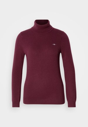 Burgundijas krāsas turtlenecks džemperis mīkstā adījumā, ar garām piedurknēm, pieguļošu dizainu un izsmalcinātu izšūtu logo uz krūtīm.