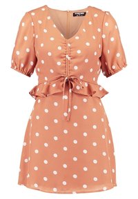 Terrakottafarbenes Polka-Dot-Kleid mit weißen Punkten, kurzen Puffärmeln, taillierter Taille, Peplum-Saum und einem Reißverschluss auf der Rückseite. Weicher Stoff.