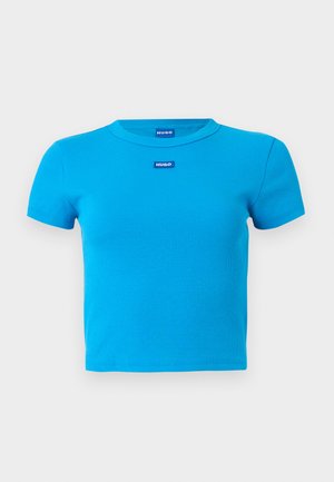 Bright blue short-sleeve ribbed crop top with crew neck and small blue "HUGO" logo tags centered near the neckline.