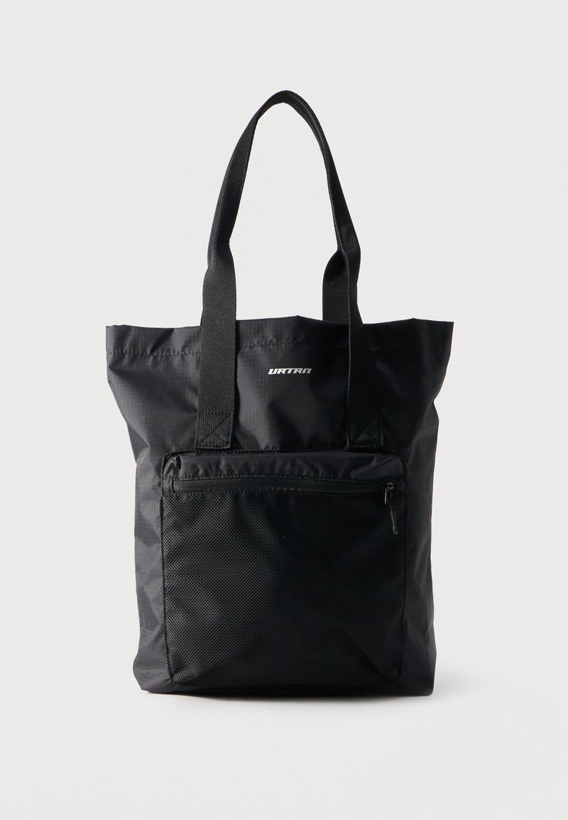 Sac cabas noir avec longues anses, poche zippée en mesh à l'avant et petit logo blanc "URTRAN" en haut au centre.