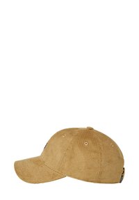 Tan corduroy cap with a curved visor, six ventilation eyelets, and an adjustable strap at the back; features subtle texture and branding.