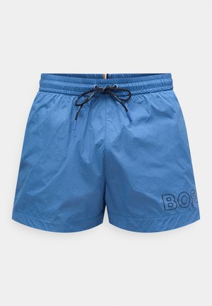 Sinised ujumispüksid kergest materjalist, varustatud elastse vöökohaga, millel on must nöör ja musta värvi küljele trükitud logo.