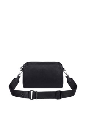 Black leather crossbody bag with two zippered compartments and adjustable detachable fabric shoulder strap with metal clasps.