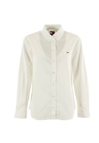 Camicia bianca a maniche lunghe con colletto appuntito, patta frontale e piccolo logo sul petto. Realizzata in un morbido materiale di cotone.
