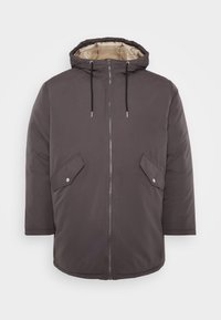 Mörkgrå vadderad jacka med huva, med dragkedja fram, två snedställda fickor och en kontrastfärgad innerfoder. Slät textur, avslappnad design.